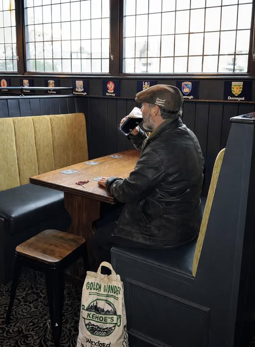 Enjoying a pint at The Corner House
